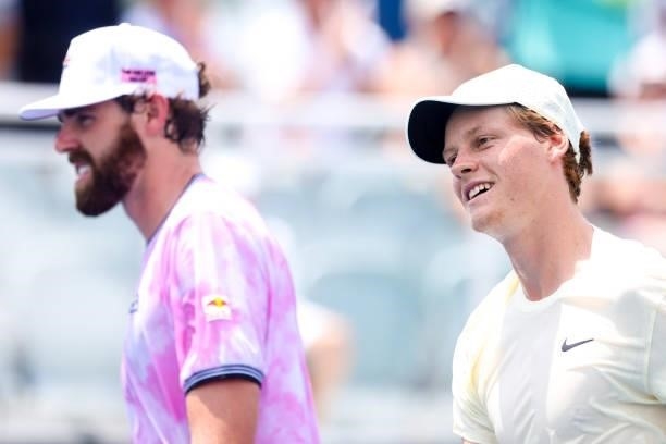 Reilly Opelka and Jannik Sinner smile after winning a doubles match against Jonathan Erlich and Santiago Gonzalez at the Truist Atlanta Open at...