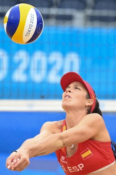 Spain's Elsa Baquerizo McMillan sets the ball in their women's preliminary beach volleyball pool B match between the USA and Spain during the Tokyo...