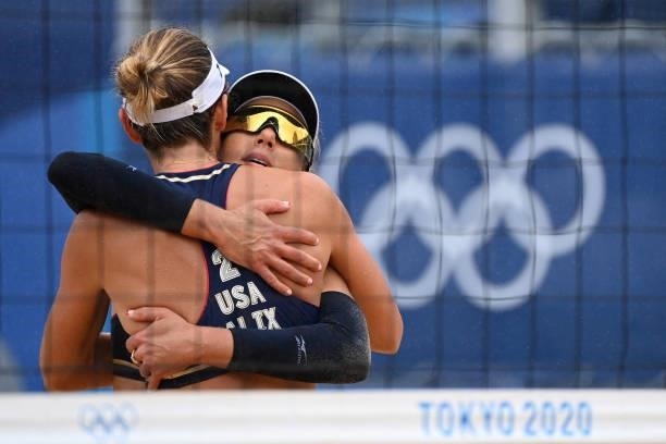 S April Ross hugs partner Alix Klineman in their women's preliminary beach volleyball pool B match between the USA and Spain during the Tokyo 2020...