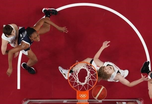 France's Sandrine Gruda and Japan's Maki Takada fight for a rebound during the women's preliminary round group B basketball match between France and...