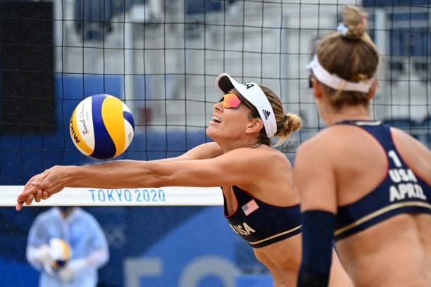 S April Ross watches partner Alix Klineman set the ball in their women's preliminary beach volleyball pool B match between the USA and Spain during...