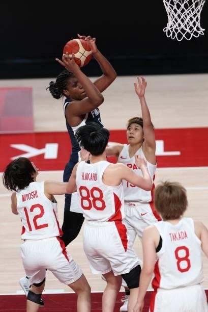 France's Endene Miyem goes to the basket past Japan's Himawari Akaho in the women's preliminary round group B basketball match between France and...