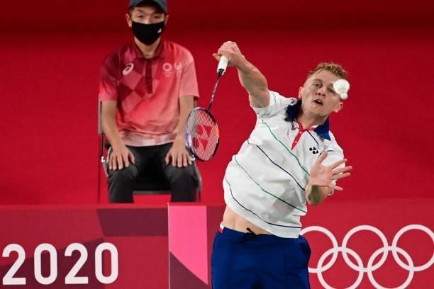 Estonia's Raul Must hits a shot against Spain's Pablo Abian in their men's singles badminton group stage match during the Tokyo 2020 Olympic Games at...