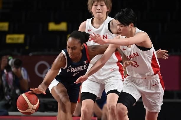 France's Sandrine Gruda dribbles the ball past Japan's Himawari Akaho in the women's preliminary round group B basketball match between France and...