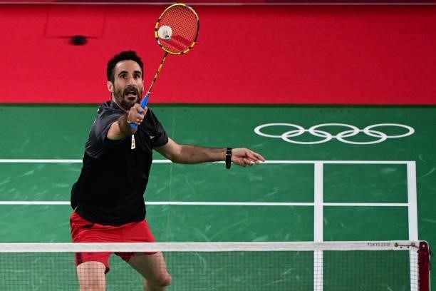 Spain's Pablo Abian hits a shot against Estonia's Raul Must in their men's singles badminton group stage match during the Tokyo 2020 Olympic Games at...