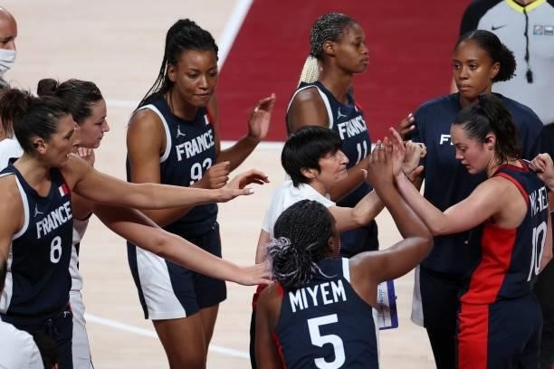France's coach Valerie Garnier speaks to her players during a breat time in the women's preliminary round group B basketball match between France and...