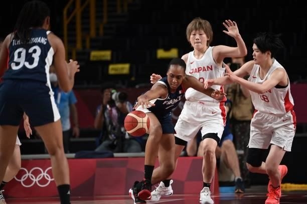 France's Sandrine Gruda dribbles the ball past Japan's Himawari Akaho in the women's preliminary round group B basketball match between France and...