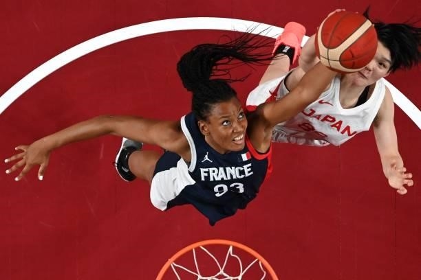 France's Diandra Tchatchouang goes to the basket as Japan's Himawari Akaho tries to block in the women's preliminary round group B basketball match...