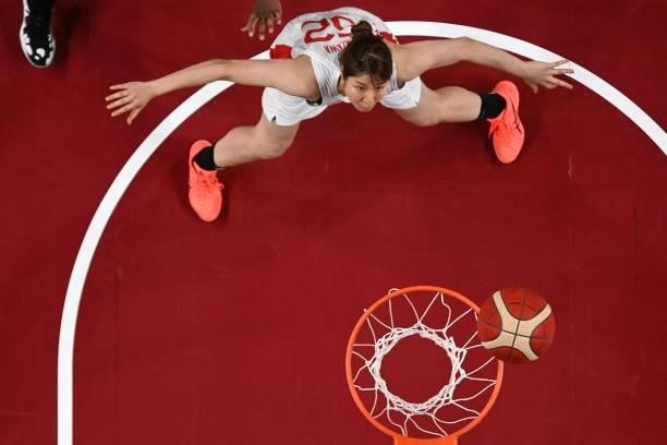 Japan's Yuki Miyazawa looks for the rebound in the women's preliminary round group B basketball match between France and Japan during the Tokyo 2020...