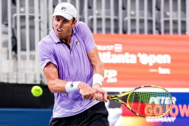 Sam Querrey of the United States returns a shot against Peter Gojowczyk during their match at the Truist Atlanta Open at Atlantic Station on July 26,...