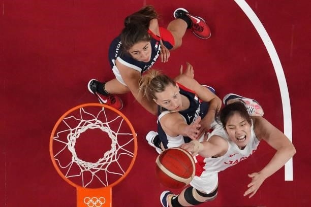 Japan's Moeko Nagaoka goes for the basket past France's Marine Johannes in the women's preliminary round group B basketball match between France and...