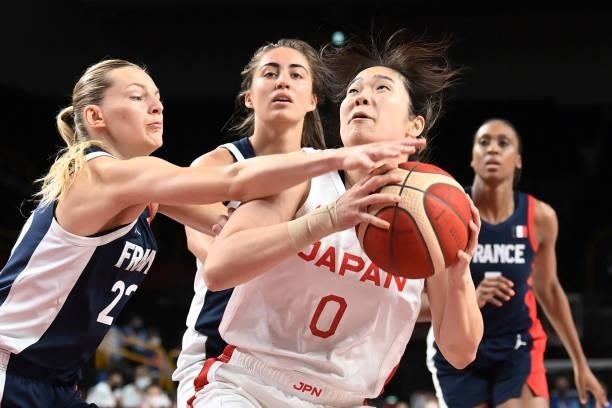 France's Marine Johannes fights for the ball with Japan's Moeko Nagaoka in the women's preliminary round group B basketball match between France and...