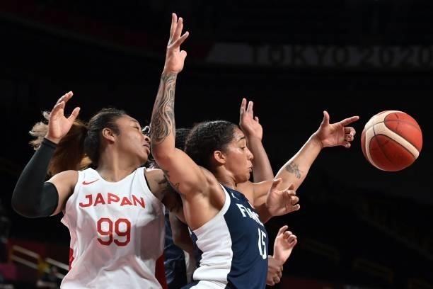 France's Gabrielle Williams and Japan's Monica Okoye fight for the ball in the women's preliminary round group B basketball match between France and...