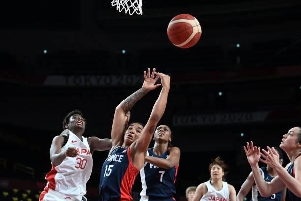 France's Gabrielle Williams , Sandrine Gruda and Japan's Evelyn Mawuli fight for the ball in the women's preliminary round group B basketball match...