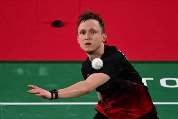 Germany's Kai Schaefer hits a shot to Britain's Toby Penty in their men's singles badminton group stage match during the Tokyo 2020 Olympic Games at...
