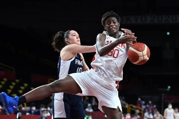 France's Sarah Michel fights for the ball with Japan's Evelyn Mawuli in the women's preliminary round group B basketball match between France and...