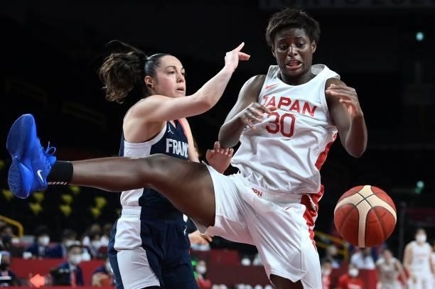 France's Sarah Michel fights for the ball with Japan's Evelyn Mawuli in the women's preliminary round group B basketball match between France and...