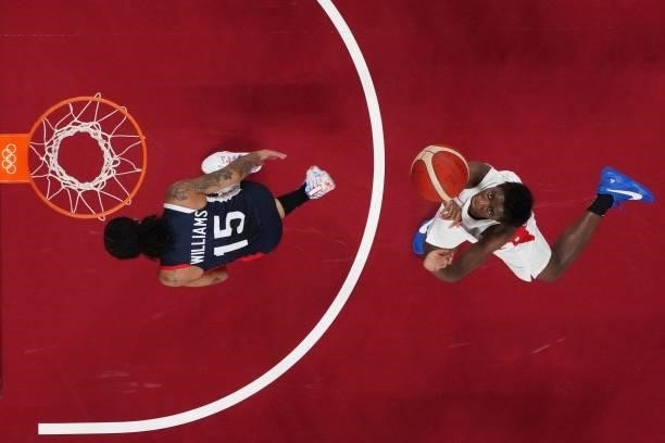 Japan's Evelyn Mawuli goes to the basket past France's Gabrielle Williams in the women's preliminary round group B basketball match between France...