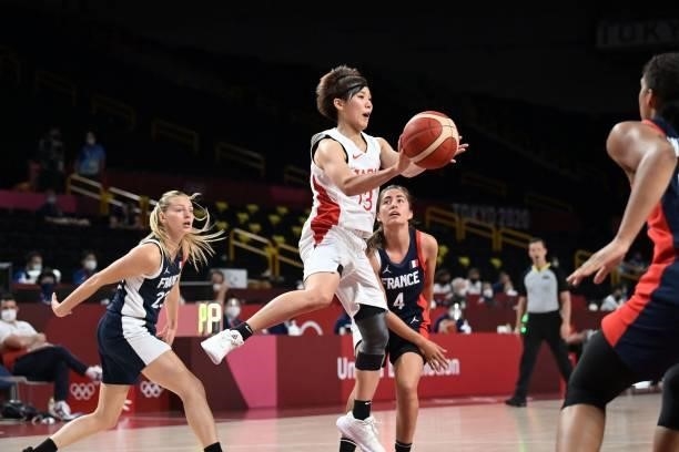 Japan's Rui Machida handles the ball in the women's preliminary round group B basketball match between France and Japan during the Tokyo 2020 Olympic...
