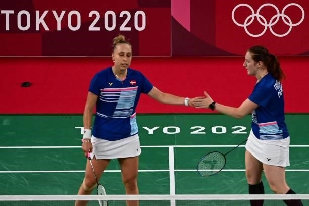 Denmark's Sara Thygesen reacts after a point with Denmark's Maiken Fruergaard in their women's doubles badminton group stage match against...