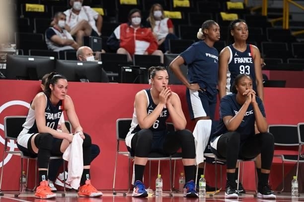 French players watch the women's preliminary round group B basketball match between France and Japan during the Tokyo 2020 Olympic Games at the...