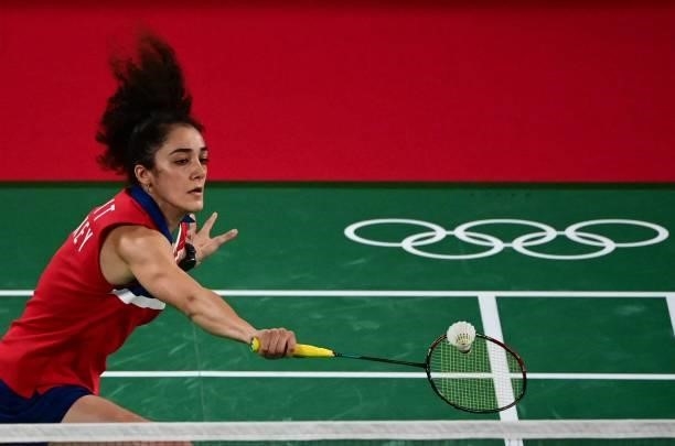 Turkey's Neslihan Yigit hits a shot to Egypt's Doha Hany in their women's singles badminton group stage match during the Tokyo 2020 Olympic Games at...