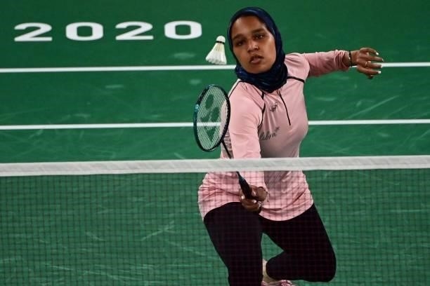 Egypt's Doha Hany hits a shot to Turkey's Neslihan Yigit in their women's singles badminton group stage match during the Tokyo 2020 Olympic Games at...