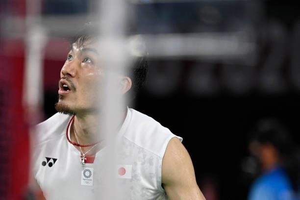 Japan's Keigo Sonoda reacts during his men's doubles badminton group stage match with Japan's Takeshi Kamura against China's Liu Yuchen and China's...