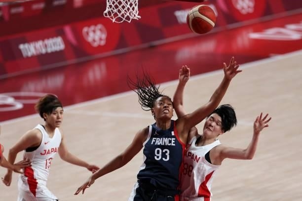 France's Diandra Tchatchouang fights for a rebound with Japan's Himawari Akaho in the women's preliminary round group B basketball match between...