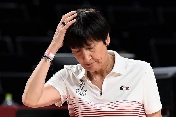 France's team coach Valerie Garnier reacts after a point in the women's preliminary round group B basketball match between France and Japan during...