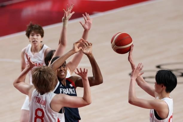 France's Diandra Tchatchouang fights for the ball Japan's Maki Takada and Himawari Akaho in the women's preliminary round group B basketball match...