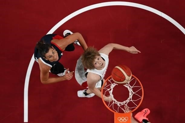 France's Helena Ciak and Japan's Maki Takada look at the basket in the women's preliminary round group B basketball match between France and Japan...