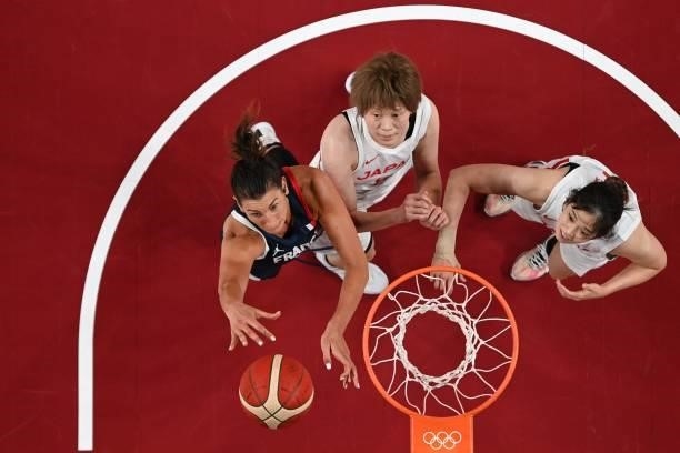 France's Helena Ciak shoots the ball as Japan's Maki Takada watches in the women's preliminary round group B basketball match between France and...