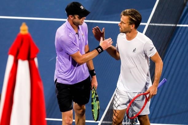 Sam Querrey of the United States and Peter Gojowczyk of Germany greet each other after the end of a match at the Truist Atlanta Open at Atlantic...