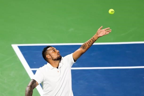 Nick Kyrgios of Australia serves during a doubles match with Jack Sock of the United States against Aisam-Ul-Haq Qureshi of Pakistan and Divij Sharan...