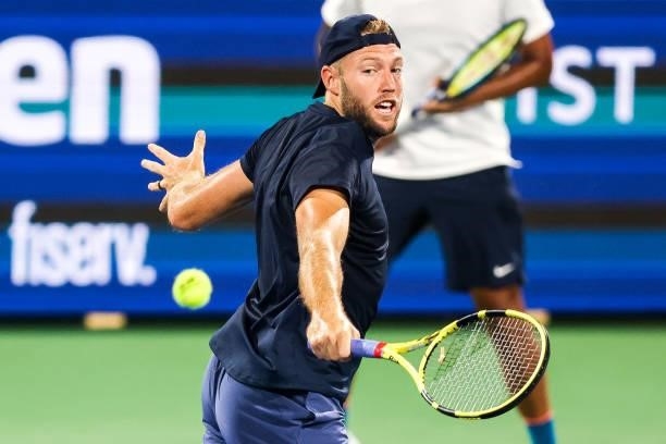 Jack Sock of the United States returns a shot during a doubles match with Nick Kyrgios of Australia against Aisam-Ul-Haq Qureshi of Pakistan and...