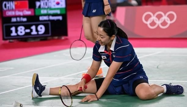 South Korea's Kong Hee-yong reacts after a point with South Korea's Kim So-yeong in their women's doubles badminton group stage match against China's...