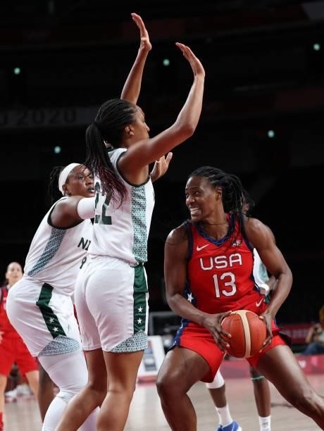 S Sylvia Fowles goes to the basket past Nigeria's Oderah Chidom in the women's preliminary round group B basketball match between Nigeria and USA...