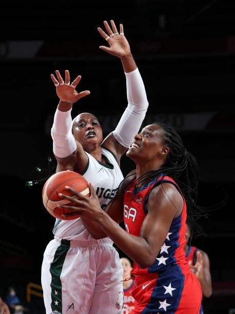 S Sylvia Fowles goes to the basket past Nigeria's Aisha Mohammed in the women's preliminary round group B basketball match between Nigeria and USA...