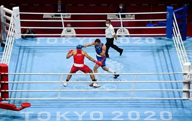 Tokyo , Japan - 27 July 2021; Ato Leau Plodzicki-Faoagali of Samoa, left, and Uladzislau Smiahlikau of Belarus during the Men's Heavyweight Round of...