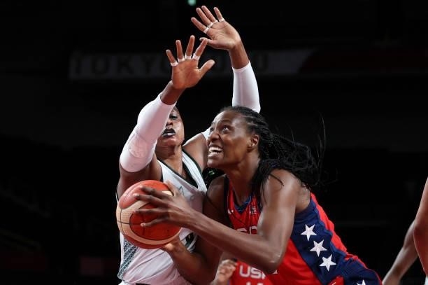 S Sylvia Fowles goes to the basket past Nigeria's Aisha Mohammed in the women's preliminary round group B basketball match between Nigeria and USA...
