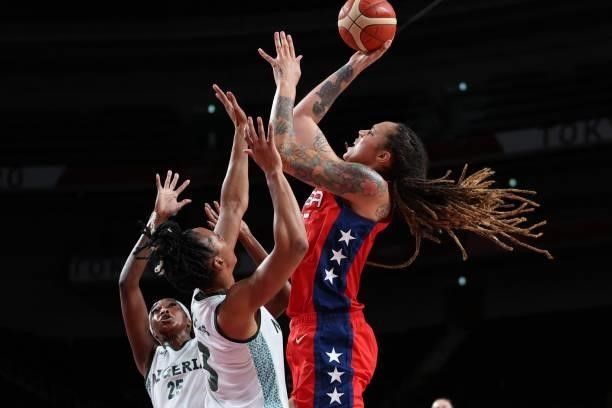 S Brittney Griner goes to the basket past Nigeria's Pallas Kunaiyi-Akpanah in the women's preliminary round group B basketball match between Nigeria...