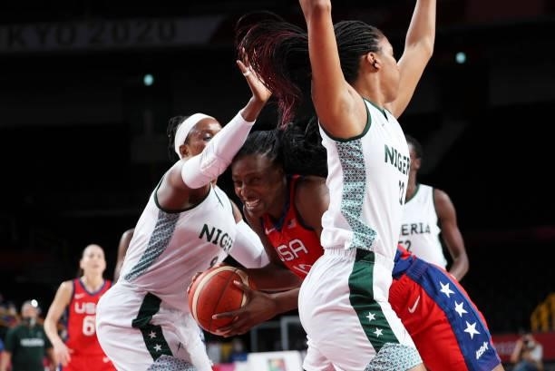 S Sylvia Fowles goes to the basket past Nigeria's Aisha Mohammed and Oderah Chidomin the women's preliminary round group B basketball match between...