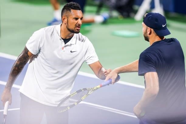 Nick Kyrgios of Australia fist bumps Jack Sock of the United States during a doubles match against Aisam-Ul-Haq Qureshi of Pakistan and Divij Sharan...