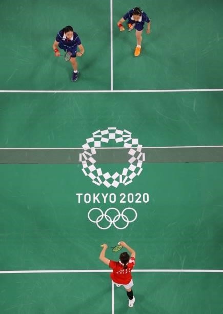 China's Jia Yifan serves in her women's doubles badminton group stage match with China's Chen Qingchen against South Korea's Kim So-yeong and South...