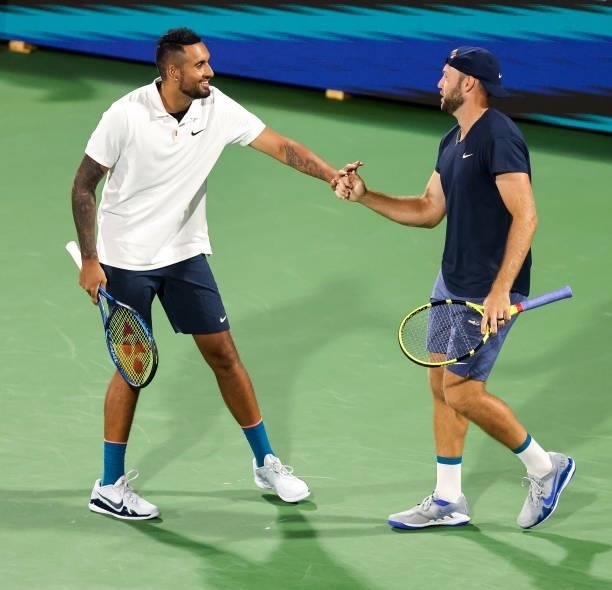 Nick Kyrgios of Australia and Jack Sock of the United States greet each other before a doubles match against Aisam-Ul-Haq Qureshi of Pakistan and...
