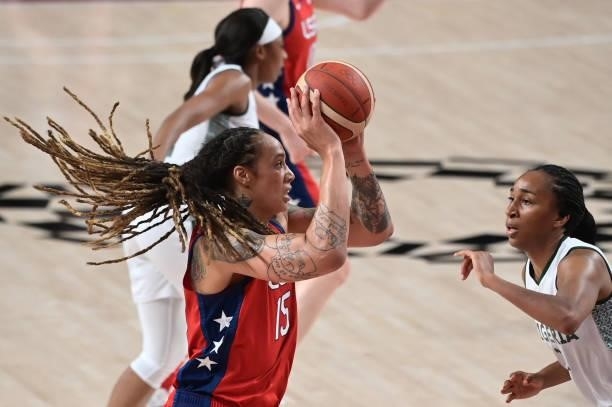 S Brittney Griner handles the ball as Nigeria's Oderah Chidom watches in the women's preliminary round group B basketball match between Nigeria and...