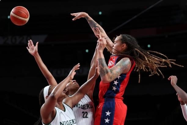 S Brittney Griner goes for the basket past Nigeria's Oderah Chidom in the women's preliminary round group B basketball match between Nigeria and USA...