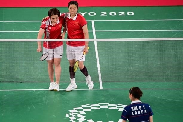China's Chen Qingchen and China's Jia Yifan gesture to their opponents after winning a women's doubles badminton group stage match against South...
