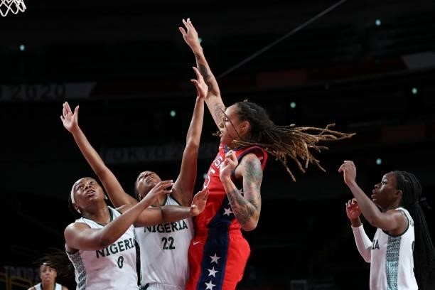 S Brittney Griner goes for the basket past Nigeria's Oderah Chidom in the women's preliminary round group B basketball match between Nigeria and USA...